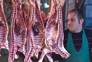 Image showing butcher sells meat on the local market