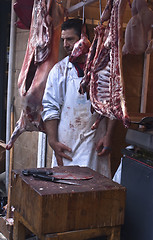 Image showing butcher sells meat on the local market