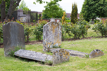 Image showing Old weathered tombs in graveyard