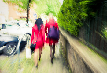 Image showing City women in red