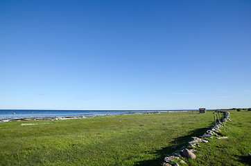 Image showing Old stonewall at coast