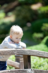 Image showing sad child outdoors