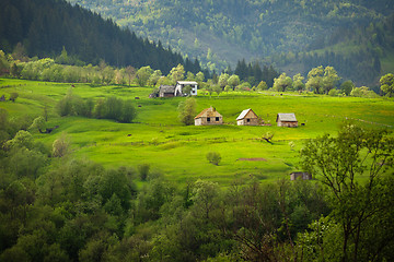 Image showing European summer landscape with mountains, meadows and houses