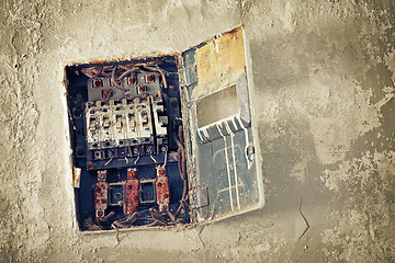 Image showing Old bad rusty switch box on wall 