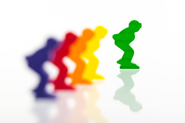 Image showing Five colored pawns isolated on a white background