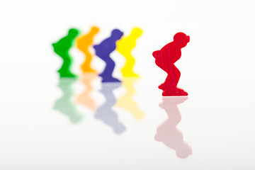 Image showing Five colored pawns isolated on a white background