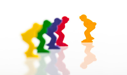 Image showing Five colored pawns isolated on a white background