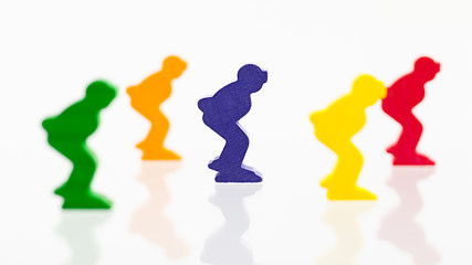 Image showing Five colored pawns isolated on a white background