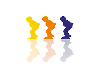 Image showing Three colored pawns isolated on a white background