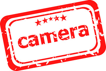 Image showing camera on red rubber stamp over a white background