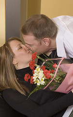 Image showing man offering flowers