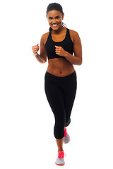 Image showing Fit female jogger, studio shot
