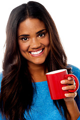 Image showing Smiling woman with coffee mug