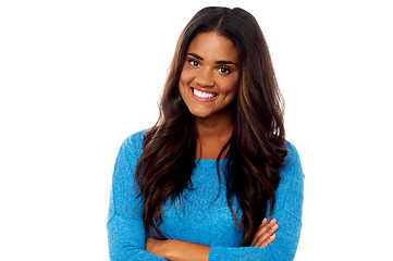 Image showing Young girl posing with her arms crossed