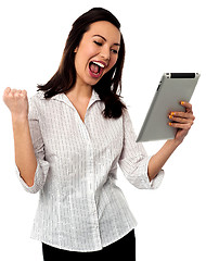 Image showing Excited businesswoman holding touch pad