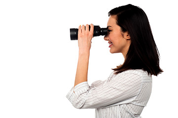 Image showing Corporate woman viewing through binoculars