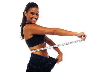 Image showing Slim woman measuring her waist