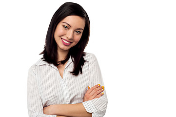 Image showing Female secretary posing with arms crossed