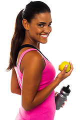 Image showing Eat healthy, stay fit. Smiling african girl.