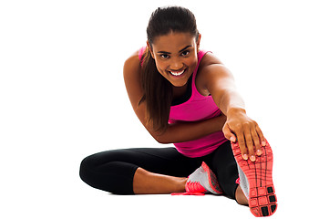 Image showing Fitness girl doing stretching exercise