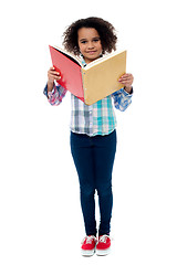 Image showing School girl a reading book