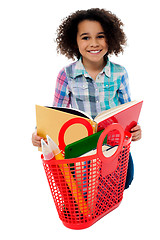 Image showing Elementary age school girl reading a book