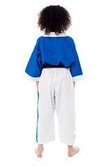 Image showing Back pose of a small girl in karate uniform