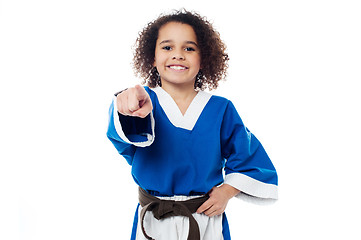 Image showing Smiling karate girl pointing towards you