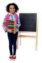 Image showing School girl with abacus and pink backpack