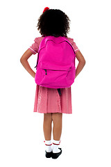 Image showing Primary school girl facing wall