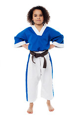 Image showing Young confident karate kid posing