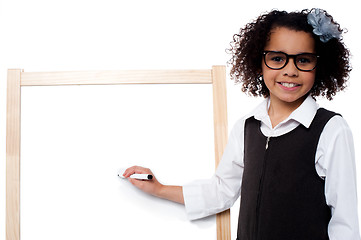 Image showing Young kid about to write on whiteboard