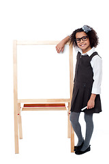 Image showing Bright student resting her hand on whiteboard