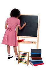 Image showing Rear view of school girl in maths class