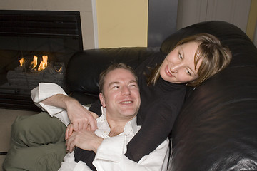 Image showing happy couple relaxing on couch