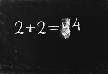 Image showing Ooops. Simple math operation 2+2= writing chalk on blackboard.