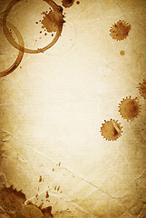 Image showing Classic vintage background. Old paper sheet with drops of coffee