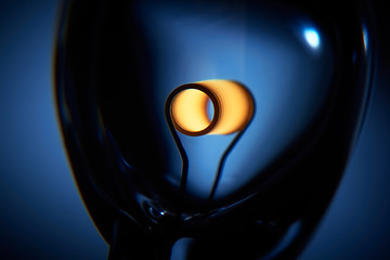 Image showing Glower is heated. Conceptual shot of incandescent lamp in blue.