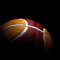 Image showing Close-up of a basketball isolated on black background