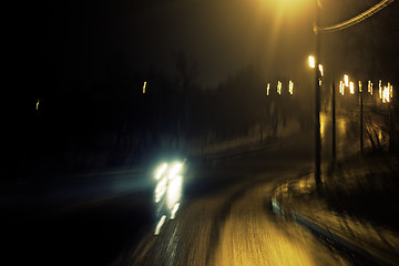 Image showing Romantic night view of the road turn with lanterns. Blurred shot