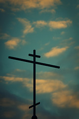 Image showing Church cross with sunset sky in the background.