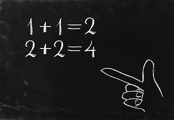 Image showing Simple math operation writing chalk on blackboard.