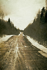 Image showing Vintage depressed and deserted village road. Grunge background.