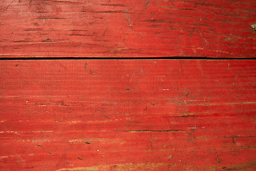 Image showing Cracked red painted planks