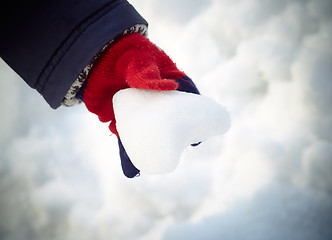 Image showing Snow heart in child hand