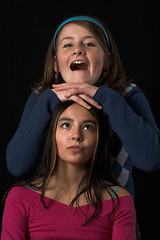 Image showing teen posing over black backdrop