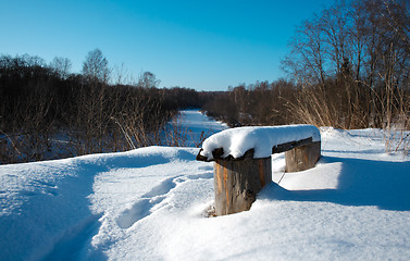 Image showing Bench covered with snow in the rural