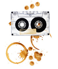 Image showing Vintage audio tape with coffee stains. Isolated on white backgro