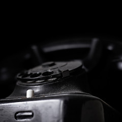 Image showing Vintage dusted phone on dark background, with copyspace.