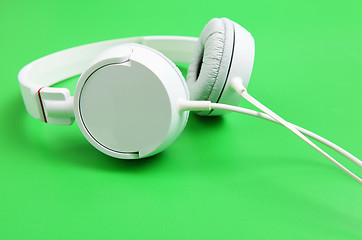 Image showing Headphone over green background